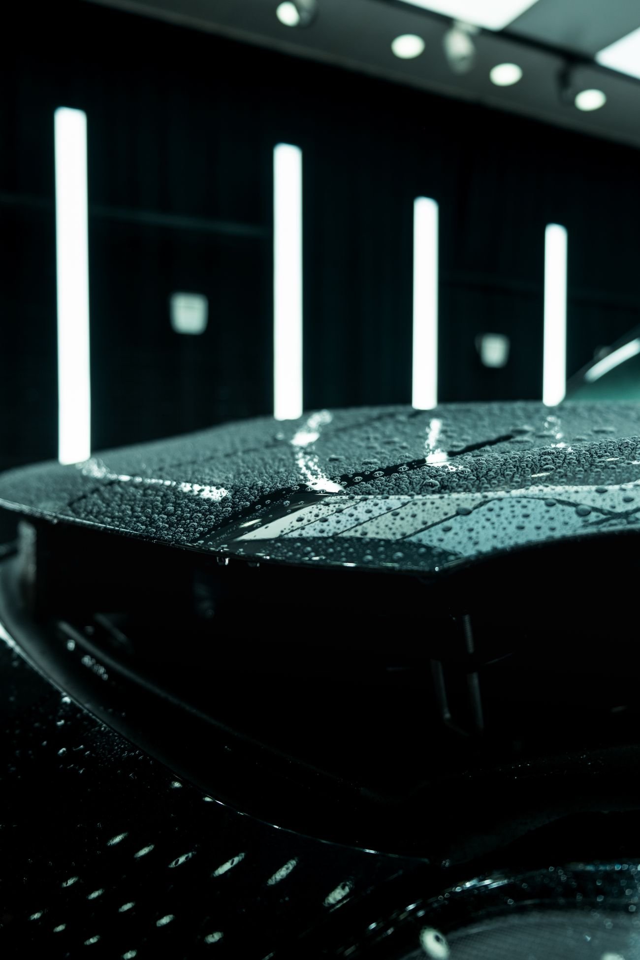 Water beading tightly on a freshly coated dark panel